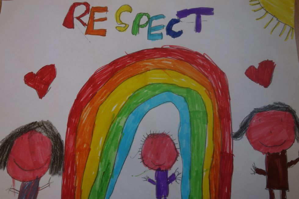  A child's drawing of a rainbow with the word respect written above it