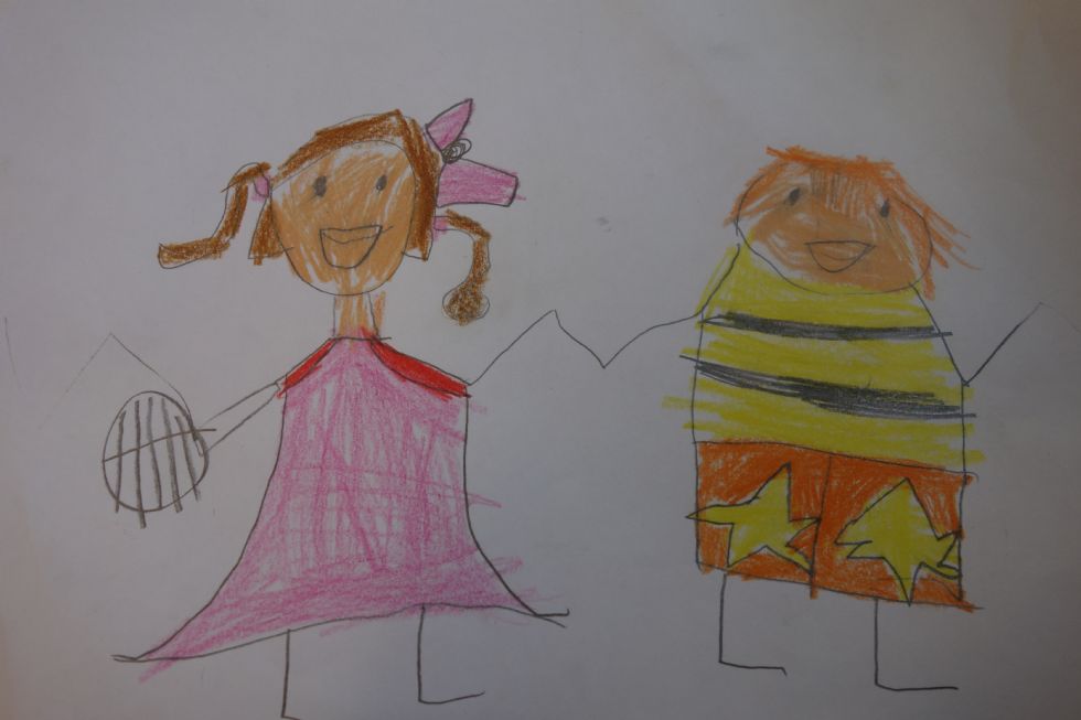 A child's drawing of a girl and boy holding hands
