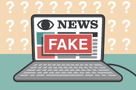 a cartoon laptop with fake news written on the screen
