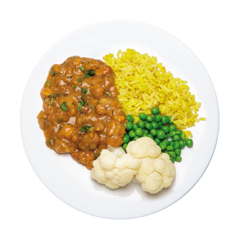 vegetable curry with yellow rice, peas and cauliflower
